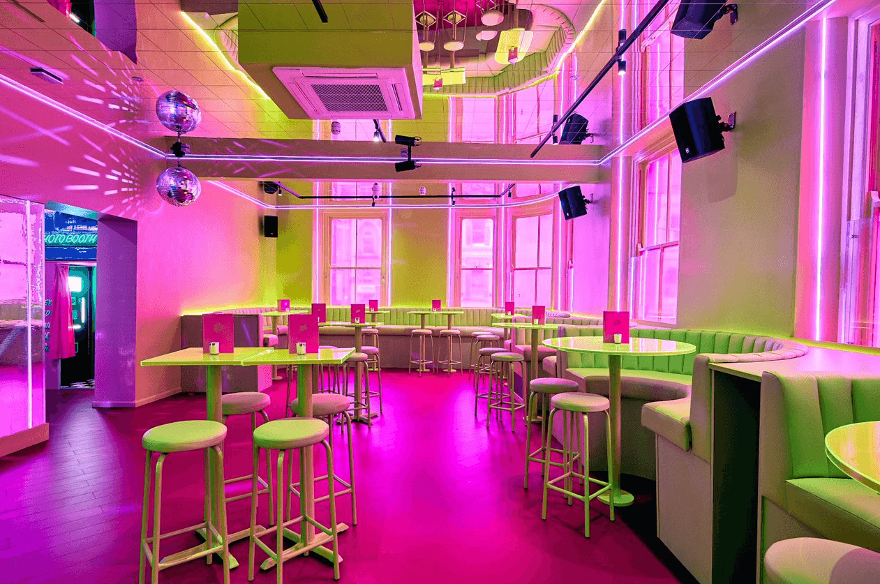 The main area of Tonight Josephine Cardiff with pink and green interiors